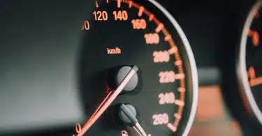 closeup photo of black analog speedometer