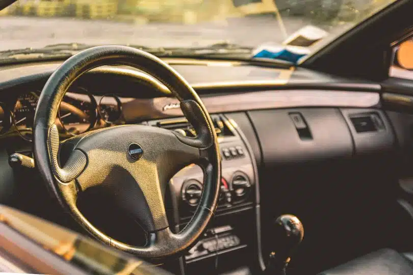 shallow focus photography of car steering wheel