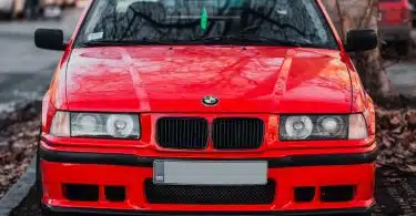 red bmw m 3 on road during daytime