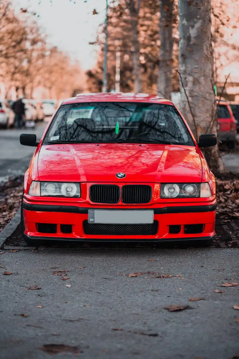 red bmw m 3 on road during daytime